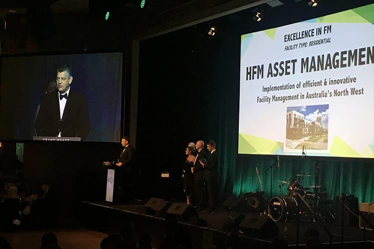 David Chokolich accepting the FM in Excellence Residential 2018 Award on behalf of HFM Asset Management