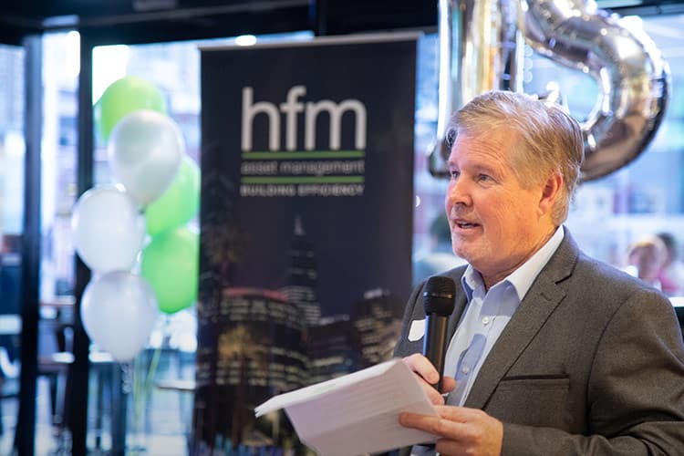 Ian Knox speaks in front of the audience at the HFM 15th year anniversary