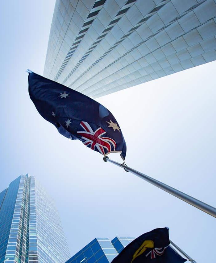 Australian flag amongst energy efficient buildings